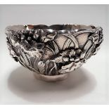 19th Century Chinese silver double walled bowl, decorated in high relief with flowers and leaves,