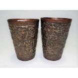 Pair of Indian brass under enamel embossed cylindrical tapered vases decorated with figures and