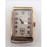 9ct gold cased manual wind wristwatch, the rectangular silver textured dial signed Bravingtons