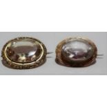 Victorian gold mounted oval brooch set a large clear cut stone, with engraved decoration, width