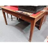 Edwardian oak writing table, the moulded top inset with red leather gilt tooled writing inset over
