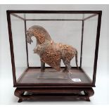 Chinese Tang style earthenware model of a horse with gilt metal mounted decoration, width 27cm x