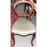 Set of six Victorian mahogany balloon back dining chairs with foliate carved mid rails, stuff over