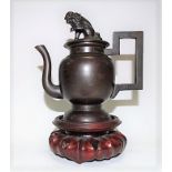 Chinese bronze silver inlaid teapot, the lid with Buddhist lion finial, the ovoid body foliate