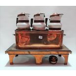 French copper three section spirit soup warmer with three pottery copper mounted jugs within an