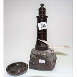 Cornish red serpentine lighthouse applied with a Spelter seagull to the rock base, height 22cm;