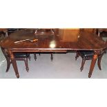 19th Century mahogany D-end extending dining table with one extra leaf, the top with reeded edge,