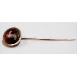 Rose gold & coloured enamel stick pin, the circular finial decorated with a glass portrait of a