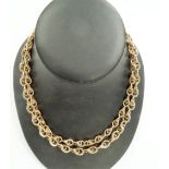 18ct gold fancy link chain with later applied curb links with 14k gold clasp, length 42cm, weight