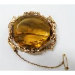 18ct gold mounted large citrine set brooch, the oval cut citrine of 35mm x 40mm approx, within