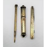 Three silver gilt engine turned implements & an etui