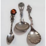 Three foreign silver spoons, one with amber inset, weight 67.5g approx.
