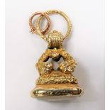 A 19th century gold plated watch fob, with foliate cast supports and foliate chased decorations,