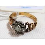 18ct hallmarked gold diamond set daisy ring, the central diamond of 0.15ct spread approx