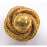 Victorian yellow metal brooch with central dome & three radiating circles applied with filigree