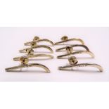 Set of eight modern hallmarked silver pins in the form of ice hockey sticks, London 1992, weight
