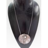 Modern designer silver pendant necklace, the pendant an abstract flower set with a pearl, maker ADB,