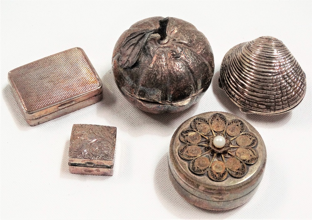 Five modern white metal boxes, including one in the form of a pumpkin and another as a clam shell,