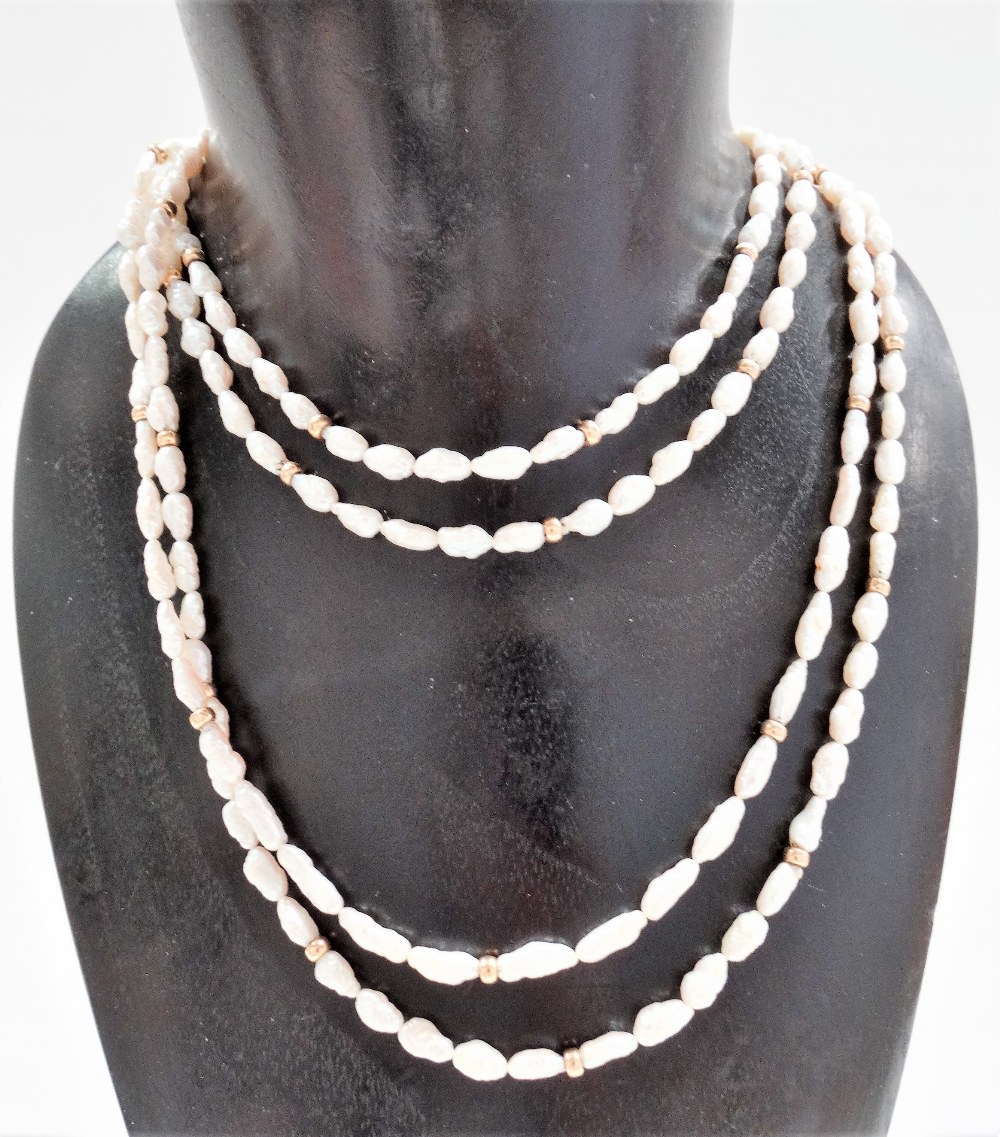 Pearl double row necklace with 14k clasp, the baroque pearls interspersed with gold beads, length