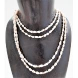 Pearl double row necklace with 14k clasp, the baroque pearls interspersed with gold beads, length