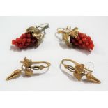 Pair of yellow metal mounted coral set earrings, the coral carved as a bunch of grapes, the metal as