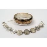 Silver bracelet made from pre-1947 threepence coins; together with a silver hollow engraved bangle