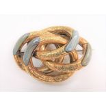 Victorian yellow metal banded agate set brooch comprising four oval loops, with foliate engraved
