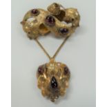 Victorian yellow metal (tested 9ct) garnet set brooch with suspended pendant on gold chain, the