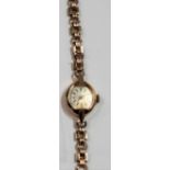 9ct gold ladies Tudor Royal manual wind wristwatch with 9ct gold bracelet, the silvered dial with