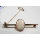 Good 9ct oval white opal set bar brooch, the opal measures 17 x 13mm approx & shows colours of