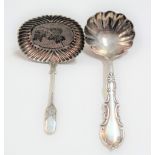 Victorian silver caddy spoon with fluted bowl, maker C & SN, London 1896; together with another