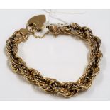 Modern 9ct gold hollow rope-twist bracelet with 9ct hallmarked lock, weight 22.1g approx