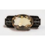 A silver marcasite & citrine set Art Deco brooch after Theodore Fahrner, width 42mm