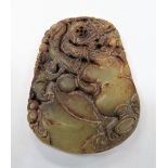 Chinese carved jade pendant, carved with an animal and motifs, length 51mm.