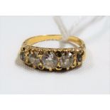 Early 20th Century gold diamond set five stone ring, the central stone of 0.50ct spread approx