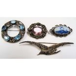 Four silver brooches.