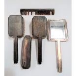 George V silver engine turned Art Deco five piece dressing table set, comprising two hairbrushes,