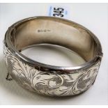 Modern silver foliate scroll engraved hollow bangle, maker S&E, Birmingham 1965, weight 1.35oz