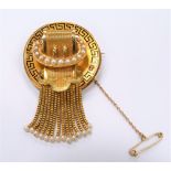 Good 19th Century French gold brooch with black enamel Greek key pattern to the edge & with engine