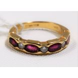 Contemporary 18ct gold diamond & ruby seven stone ring, the two diamonds of 0.05ct spread approx,