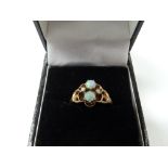 14ct gold opal & seed pearl set four stone ring, the opals of 0.20ct spread approx & showing colours