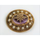 9ct hallmarked gold cabochon amethyst & pearl set oval brooch, the cabochon amethyst applied with