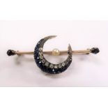 Yellow metal bar brooch applied with a crescent set with small graduating diamonds and sapphires