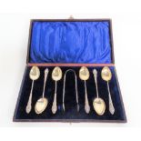 Victorian silver cased set of six demi-tasse spoons and sugar tongs with cast handles, maker W.D.,