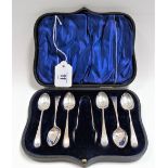 Edwardian silver cased set of six demi-tasse spoons and sugar tongs, foliate bright cut, maker HA,