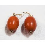 Pair of gold mounted butterscotch amber drop earrings, weight 3.5g approx