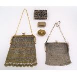 Two mesh evening purses; together with a silver filigree hinge lidded box and two other boxes.