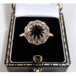 Victorian 18ct gold sapphire and diamond cluster ring, the sapphire of 1.5ct spread approx, the