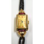 1940's 9ct ruby set cased ladies manual-wind cocktail watch with leather gold mounted strap, the