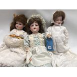 Three early 20th Century German bisque head sleep-eyed composition dolls, the others by John Bing,